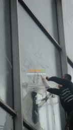 Применение жидкой пленки для окон Liquick при нанесении граффити (реклама) на фасаде ВДНХ